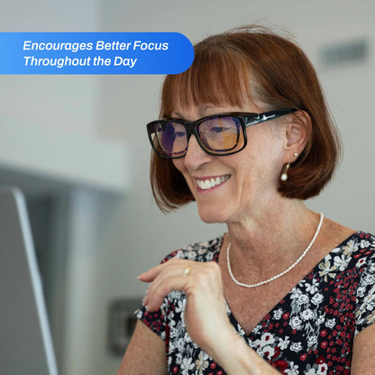 Woman wearing FitOver Blue Light with a text overlay about better focus throughout the day.