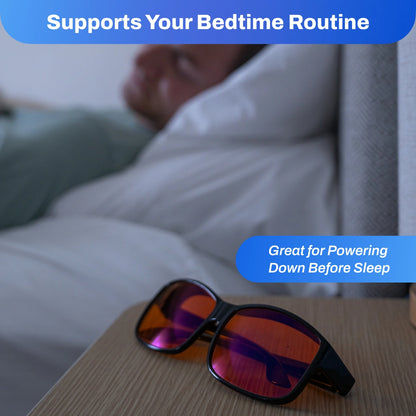 FitOver Blue Light on a table with a blurred background of someone lying in bed, text indicating support for bedtime routine.