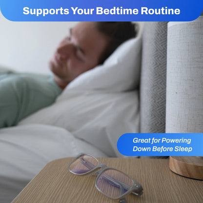 Person lying in bed with Signature Blue Light Glasses on a nightstand, text about bedtime routine.
