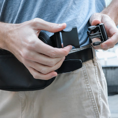 DefenderShield EMF Protection Hip Pack Black man clipping onto his body