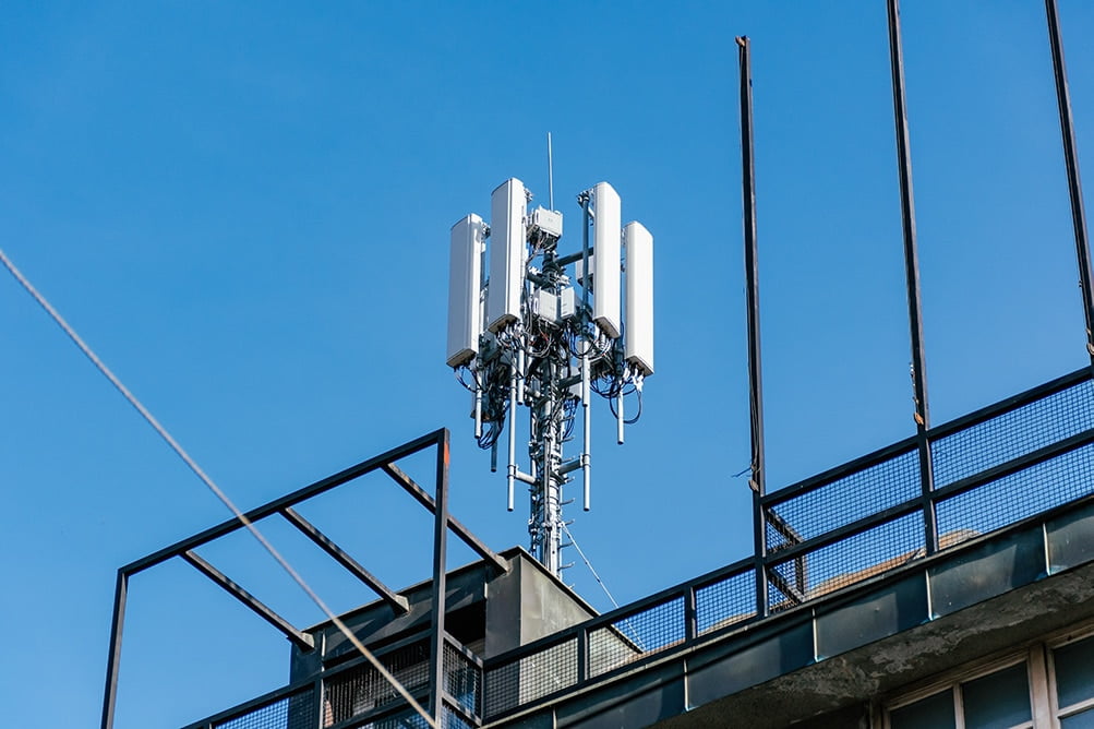 5G Network Tower in City on Building